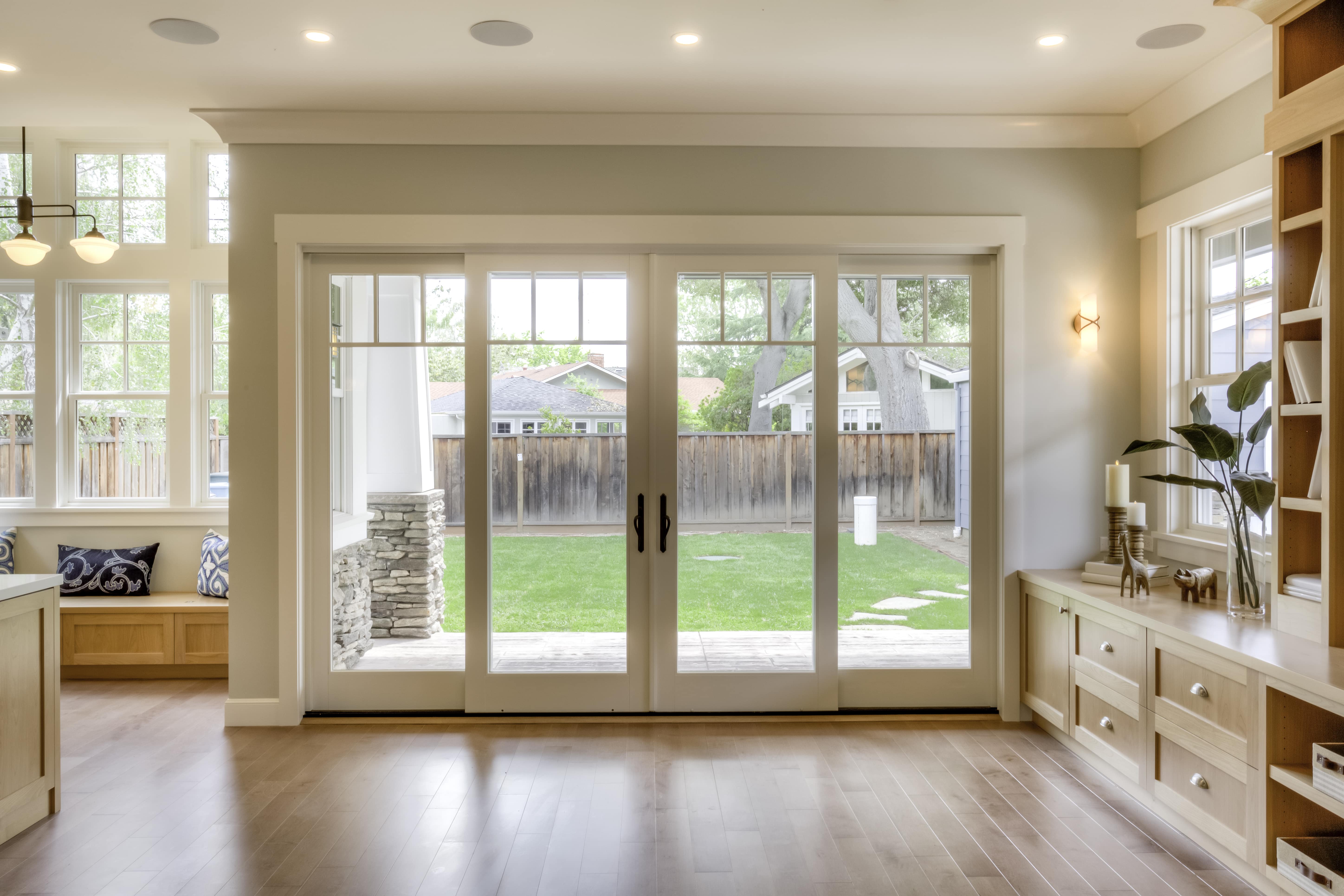 A stylish white patio door with large glass panels, perfect for a modern home.