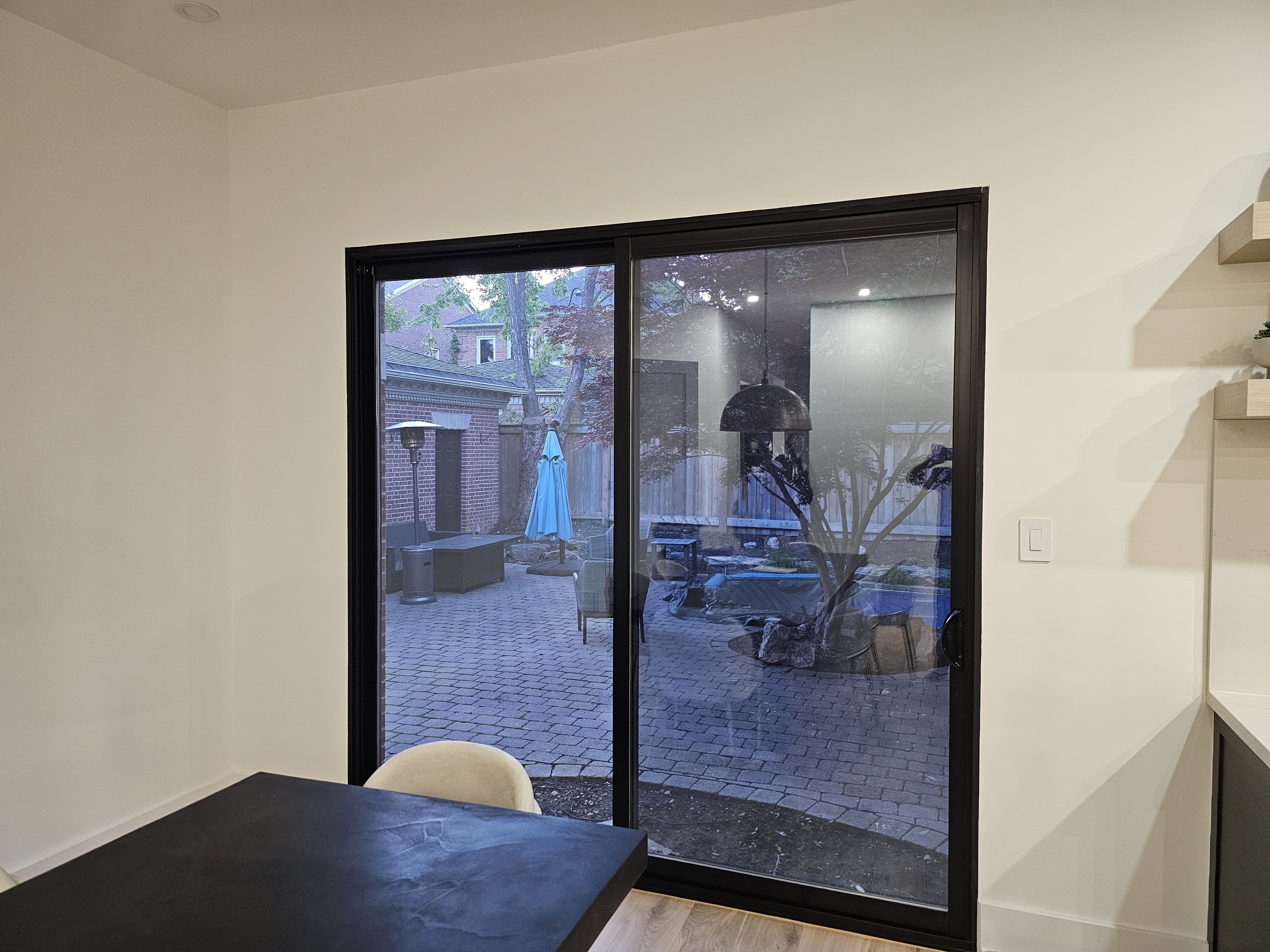 A residential home with a newly cleaned and organized patio door installation.