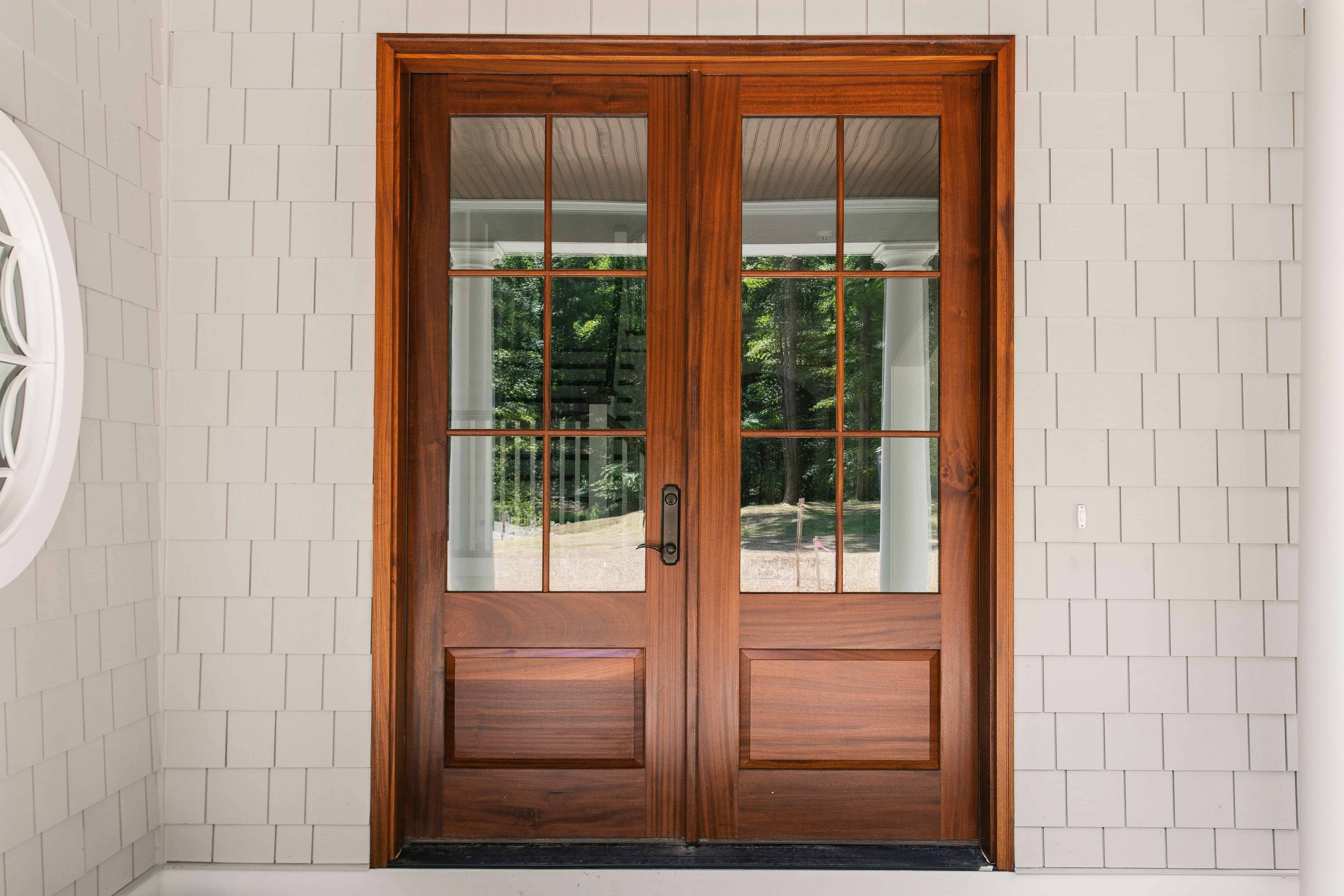 Professionally installed double entry doors with glass panels
