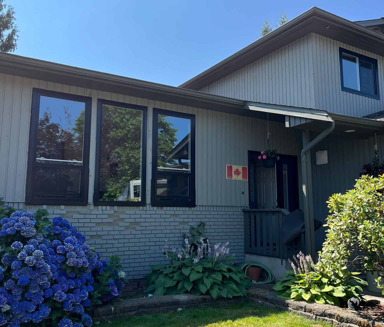 Modern home with new black-framed windows and entry door in Metro Vancouver