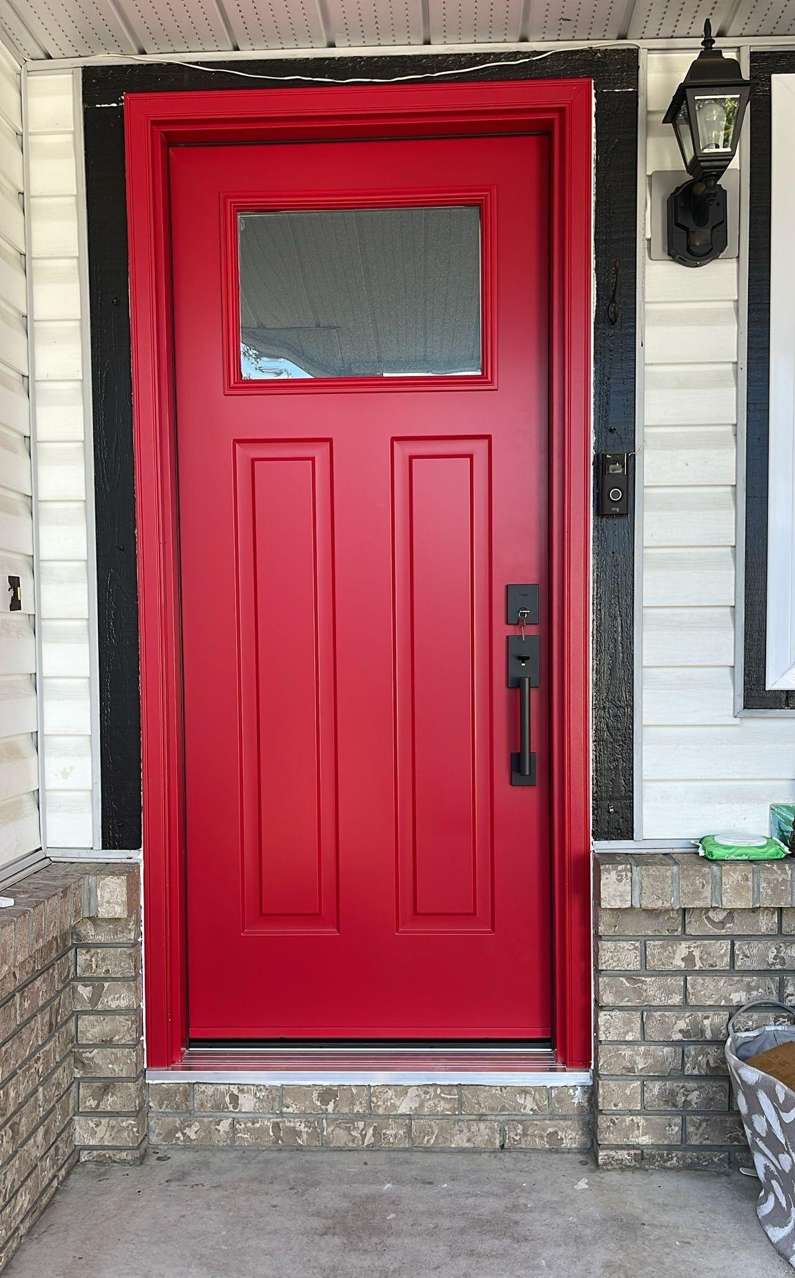 Bright red insulated entry door reducing outside noise