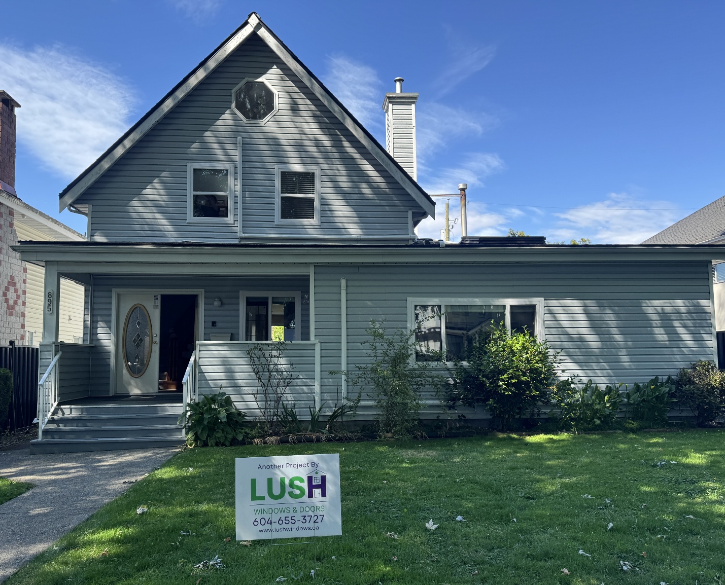 Completed Lush Windows and Doors window replacement project with yard sign at a Metro Vancouver home