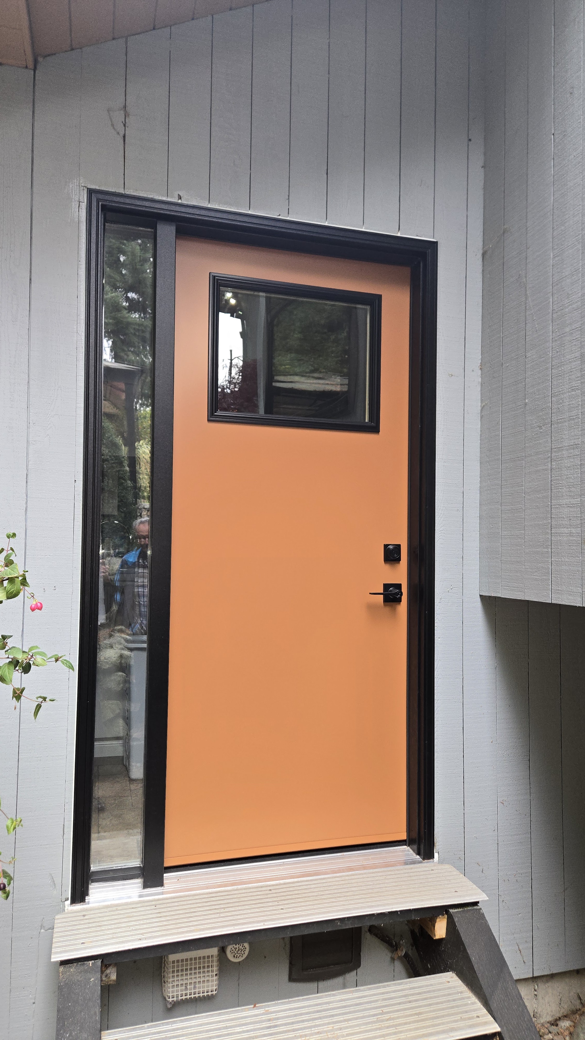 Custom-made entry door with sidelights and quarter glass panel installed in a Coquitlam home