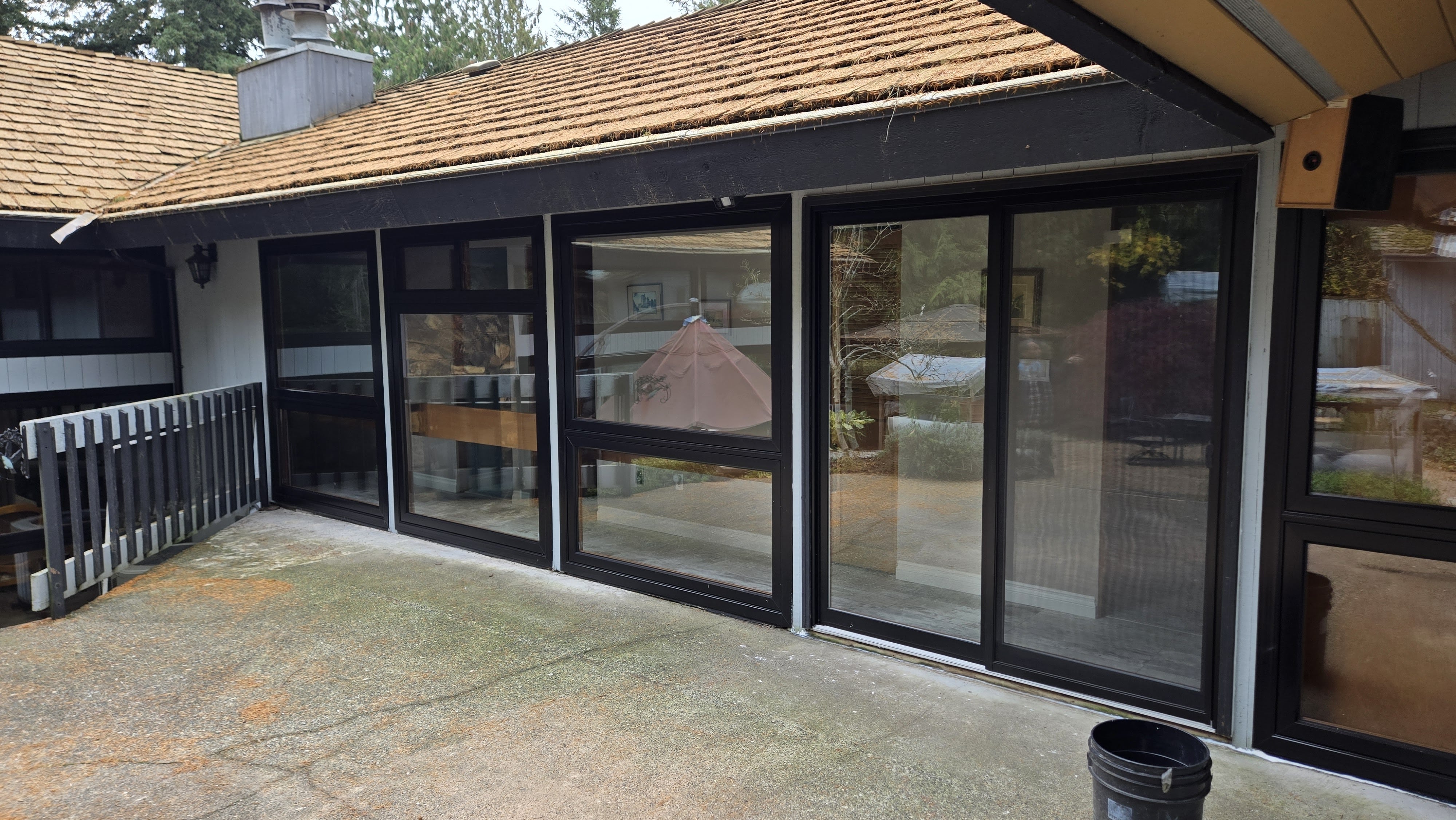 Modern North Vancouver residence with new black patio door and full window replacement on the back side
