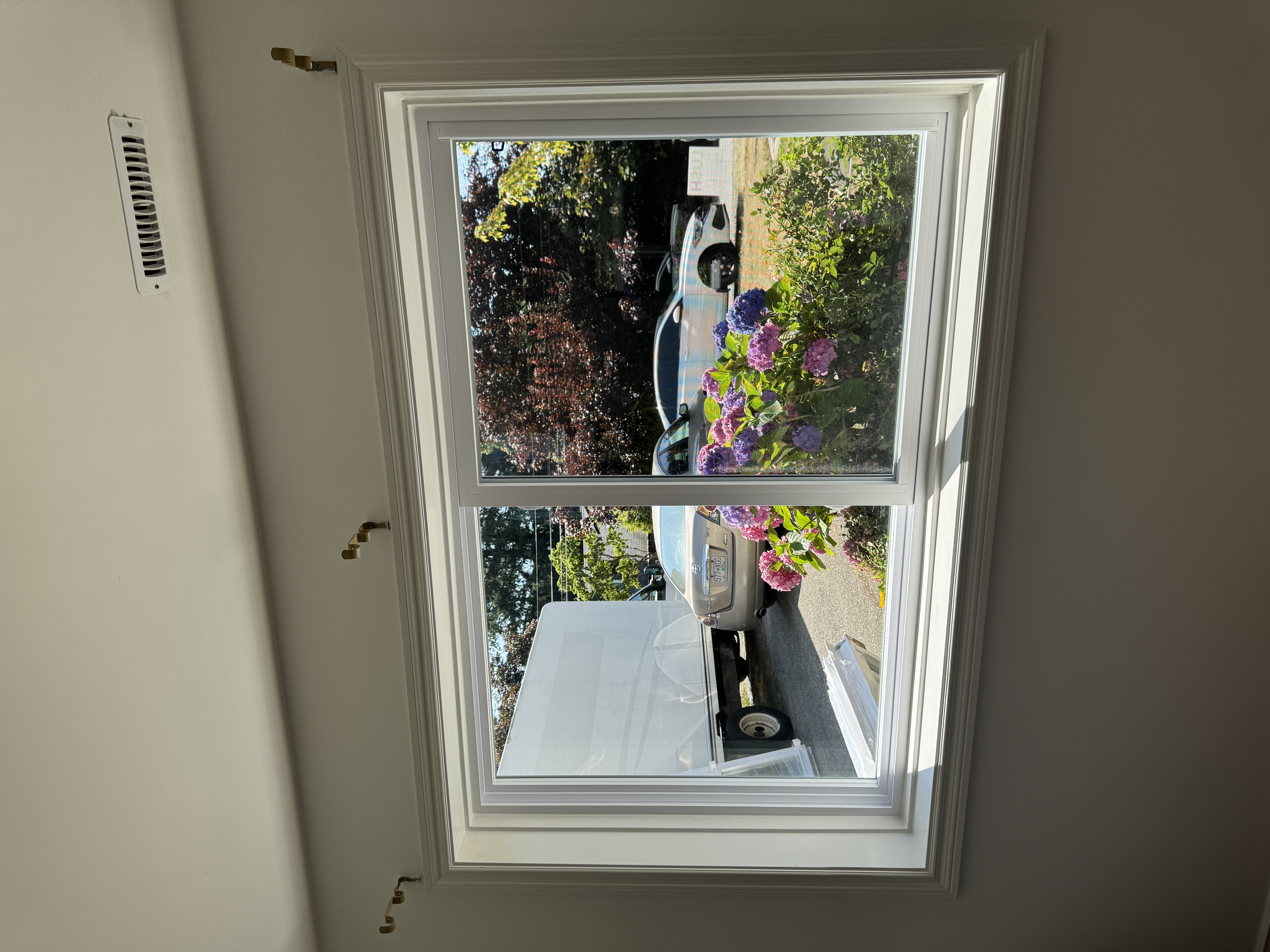 Natural light fills bedroom through elegant sliding window design in Surrey home