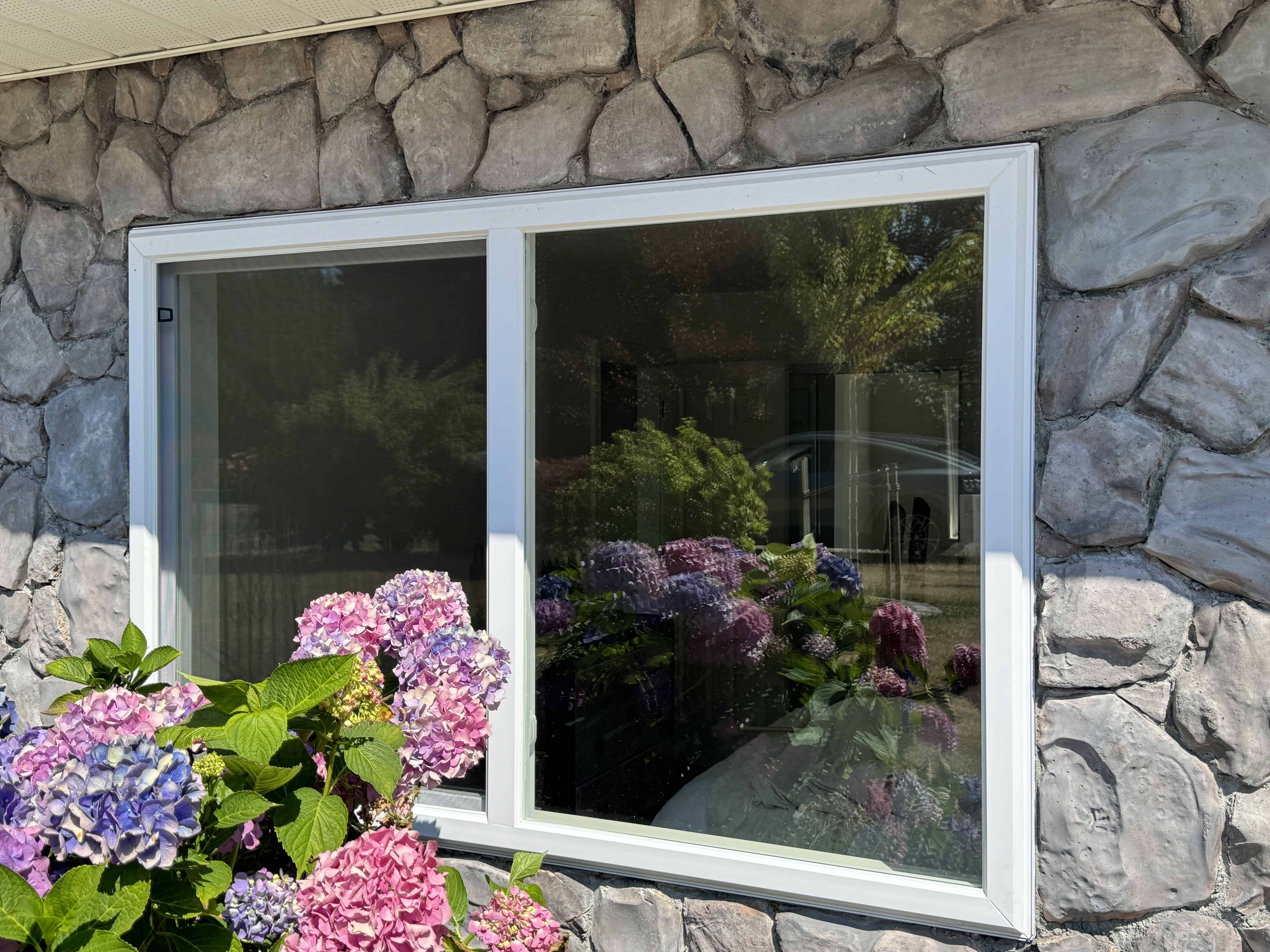 Stylish new sliding window adding natural light to floral décor in Surrey home