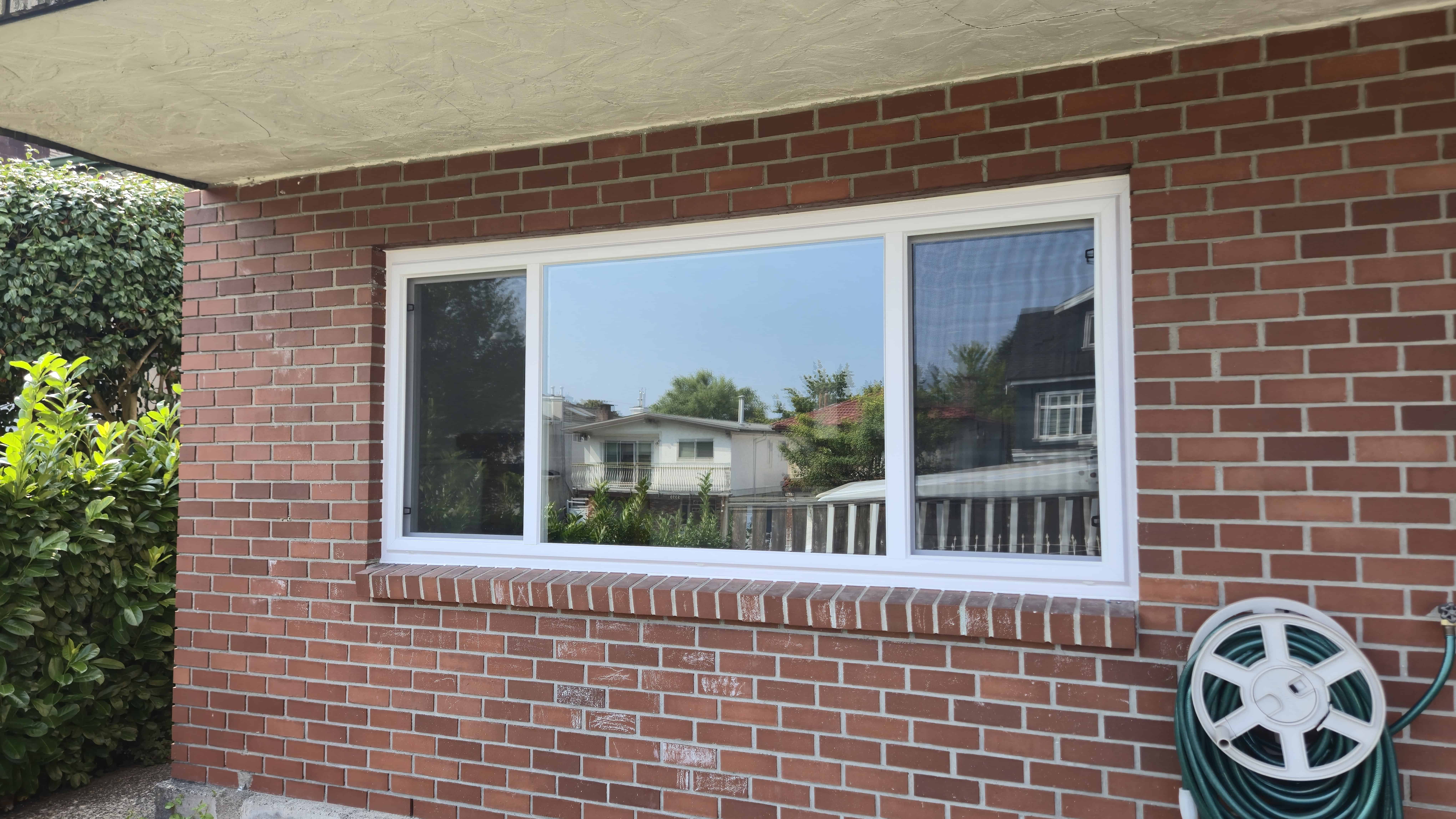 Energy-efficient end vent slider upgrade for brick home façade in Langley home