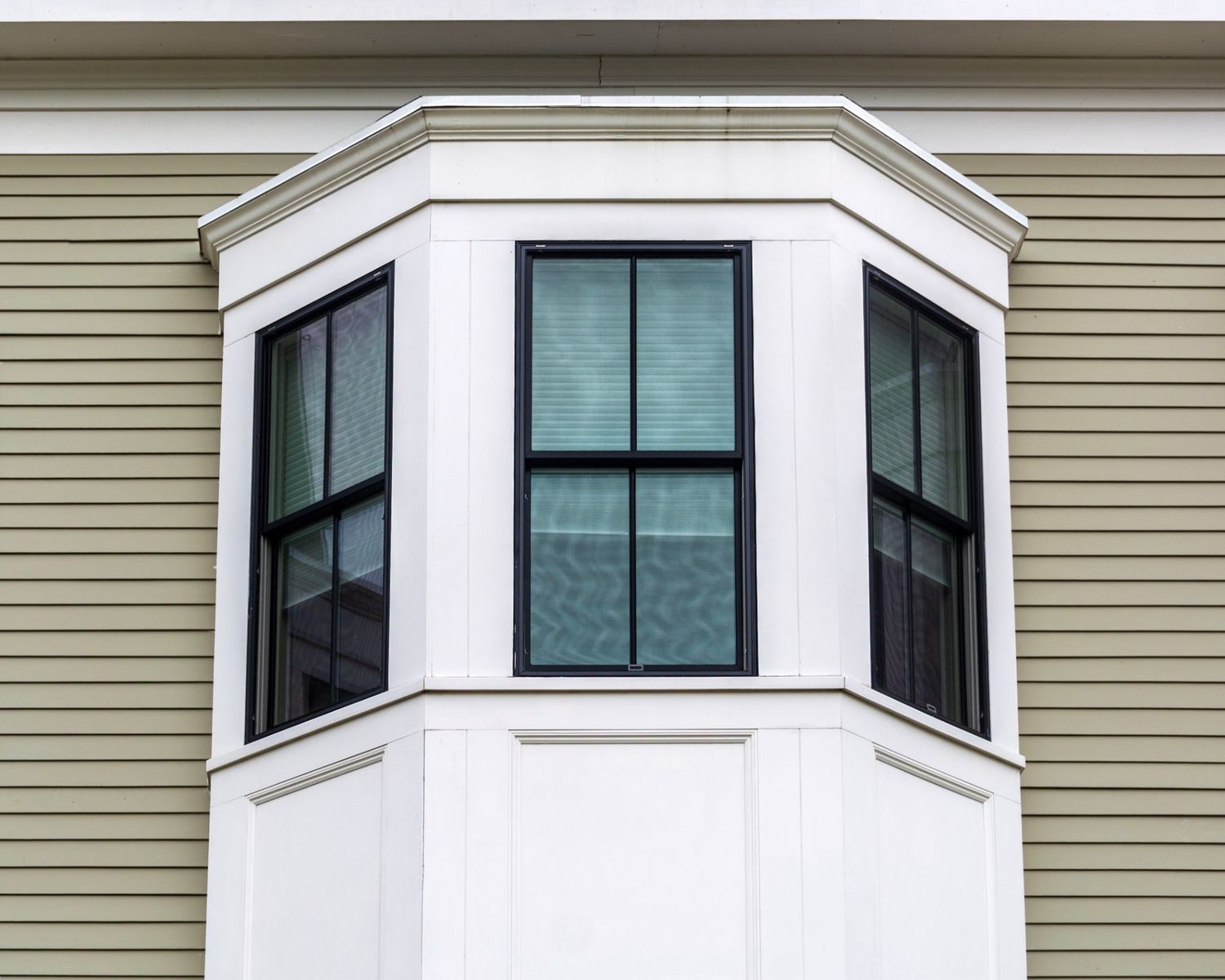 Burnaby bedroom upgraded with a custom black bay window featuring high-performance Low-E glass