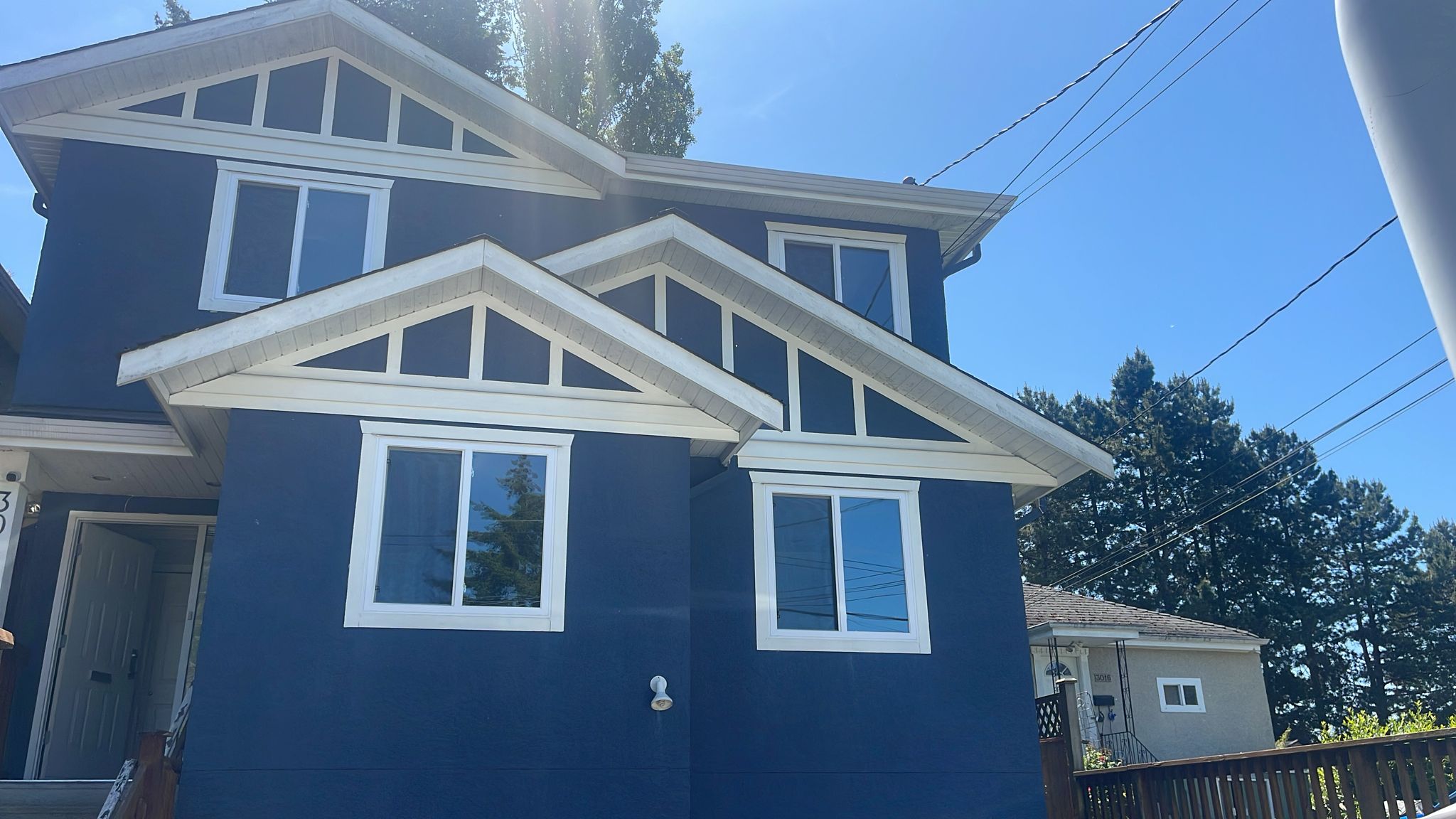 Windows replacement and upgrade on blue house in Abbotsford
