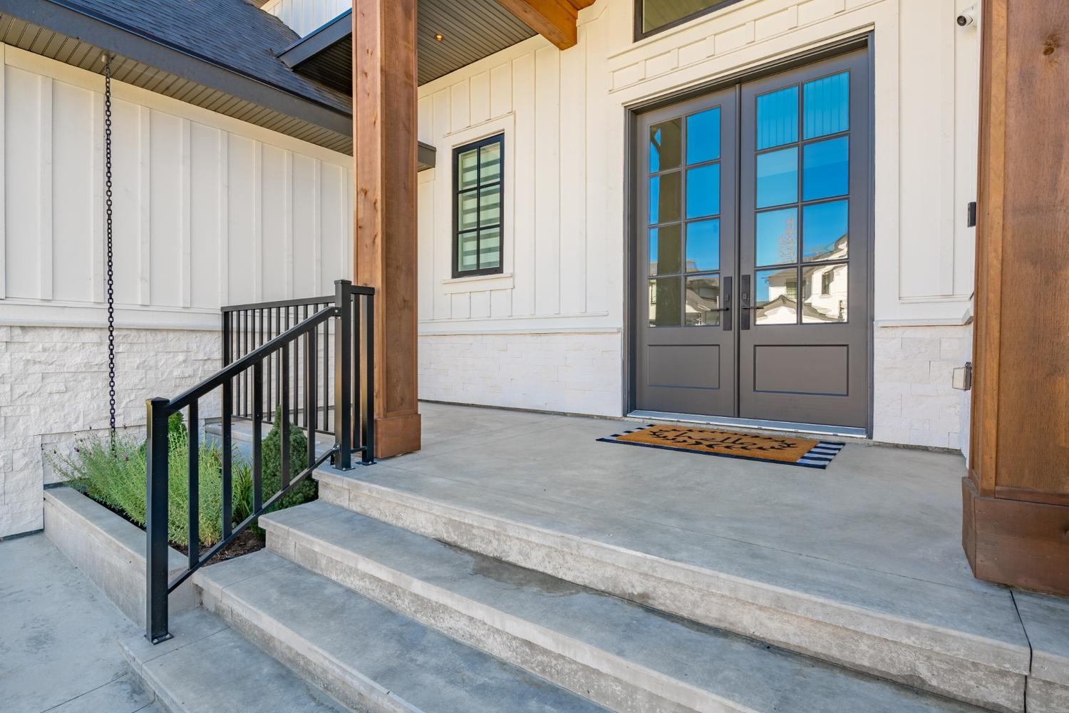 Stylish steel French door in custom color enhancing a Port Moody home’s performance and look