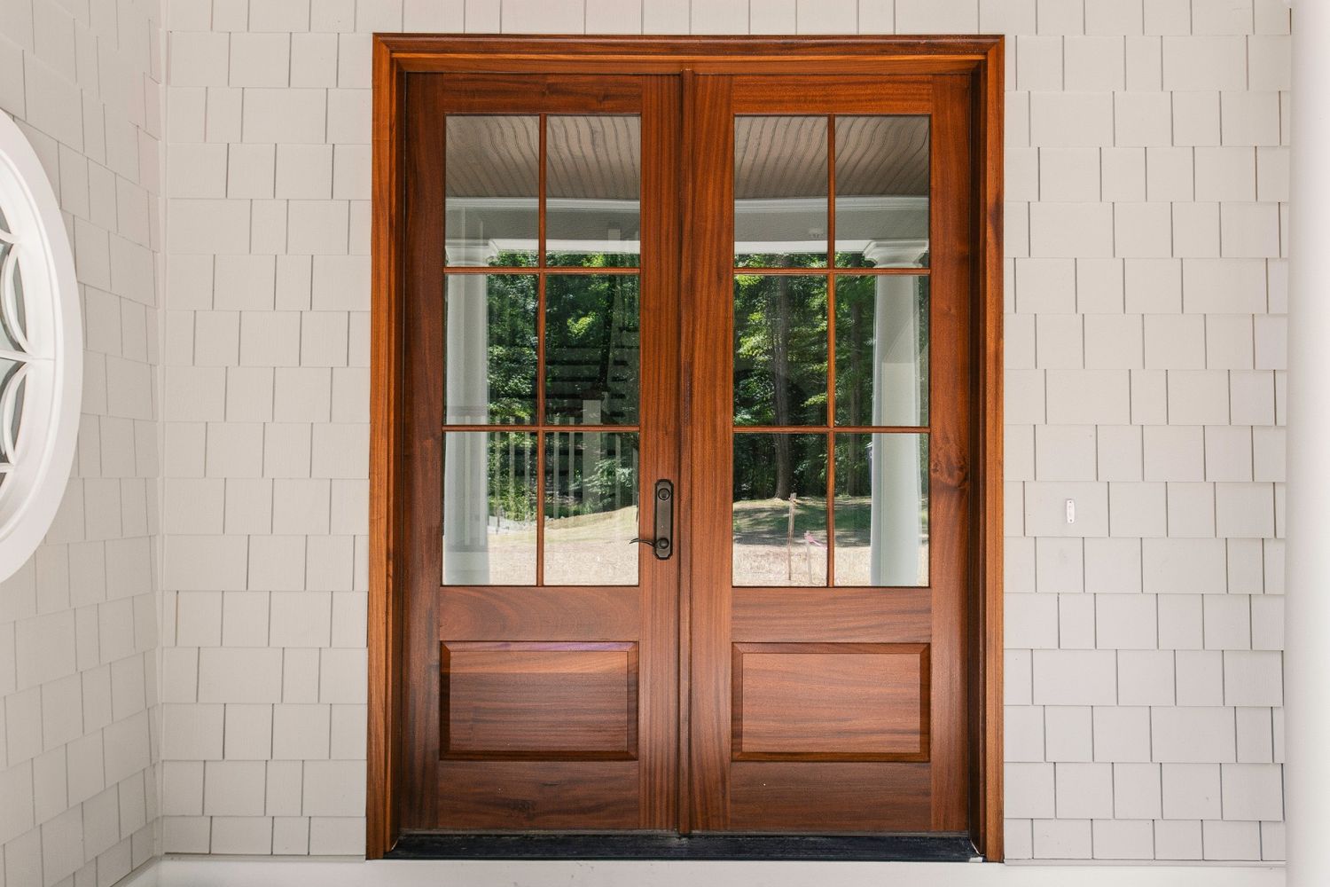 Chilliwack home featuring a cozy, custom-colour fiberglass French door