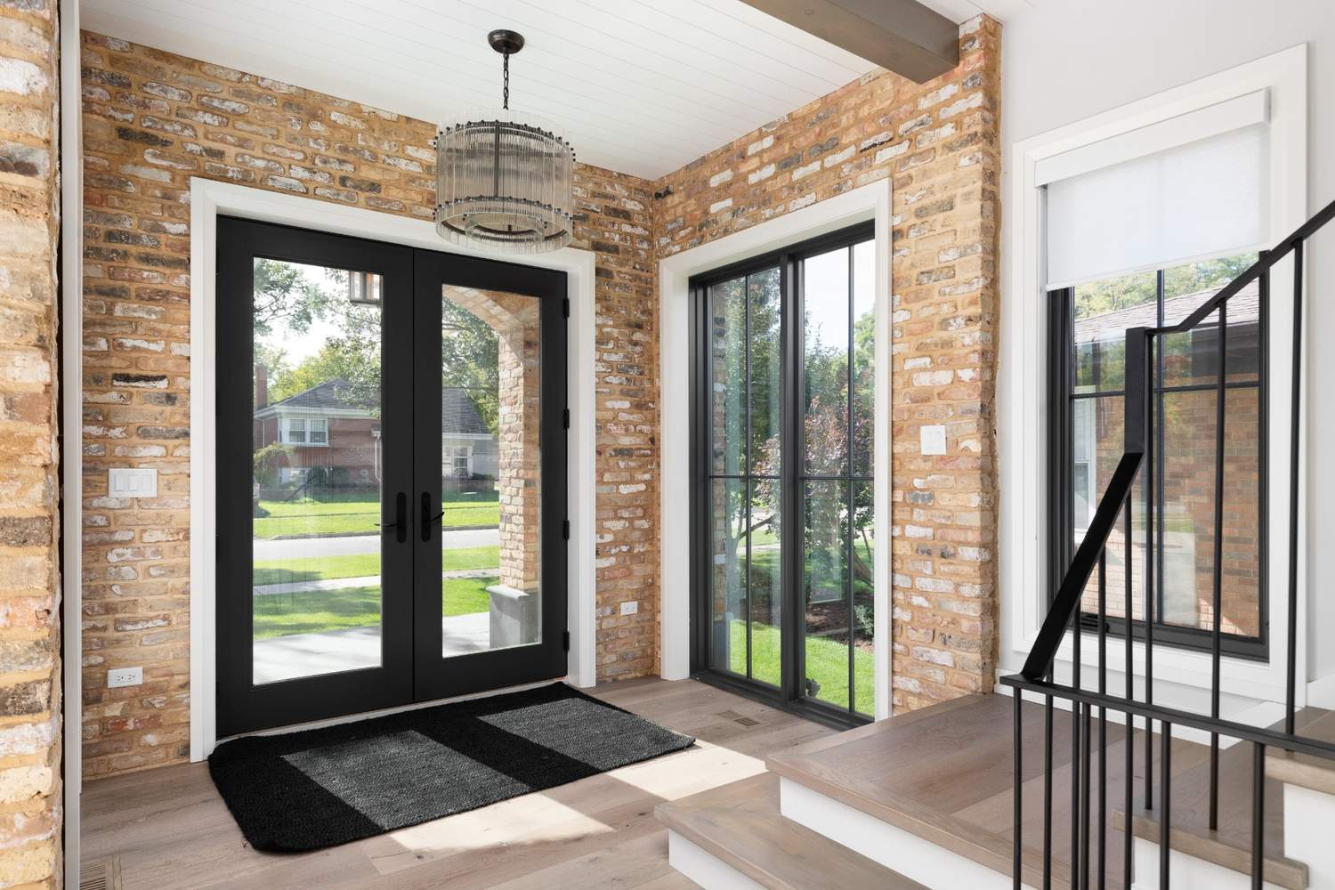 Modern black French door installed in a Richmond home with energy-efficient glass