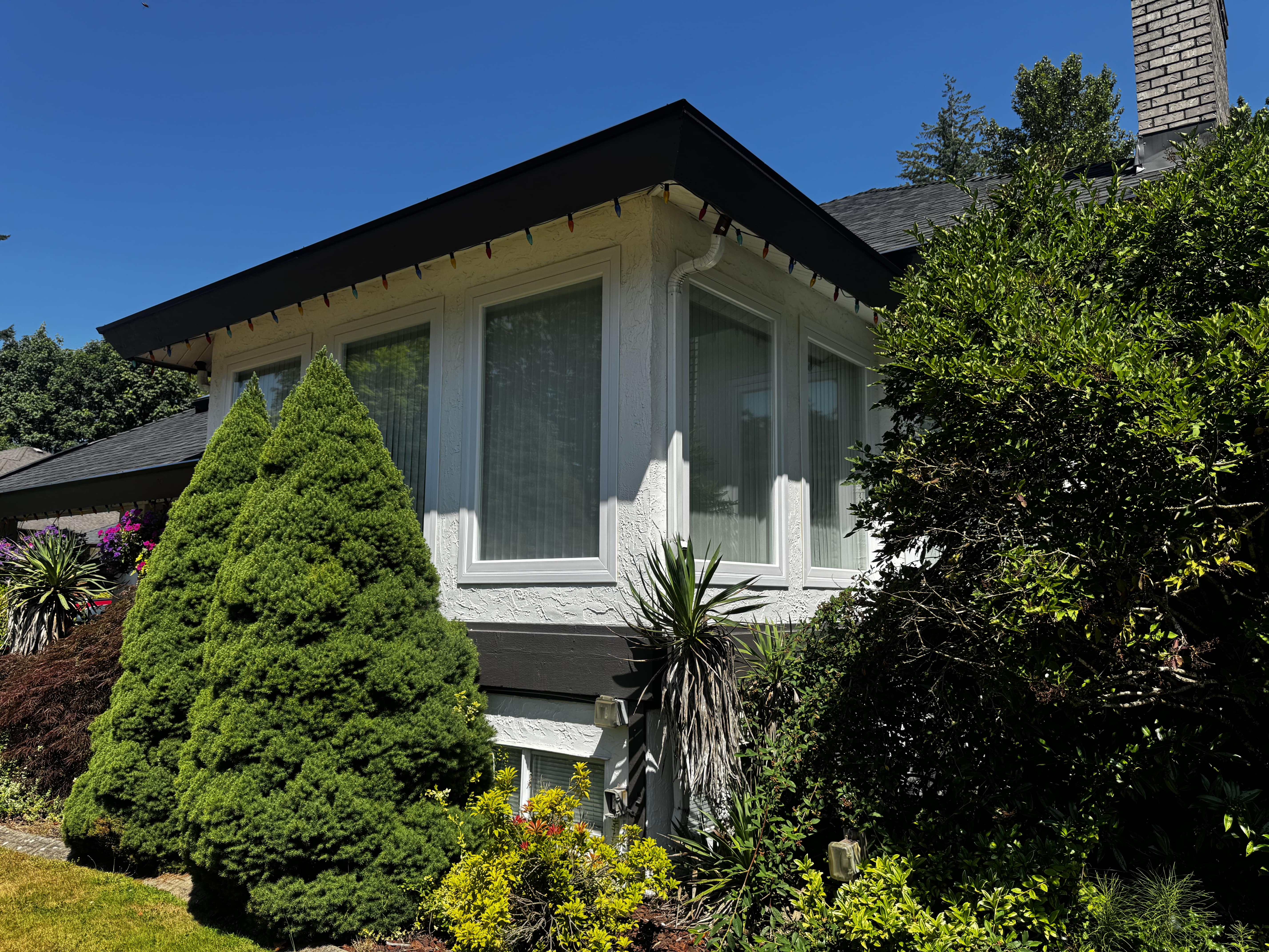 Bright living space enhanced by stylish windows for maximum sunlight in West Vancouver