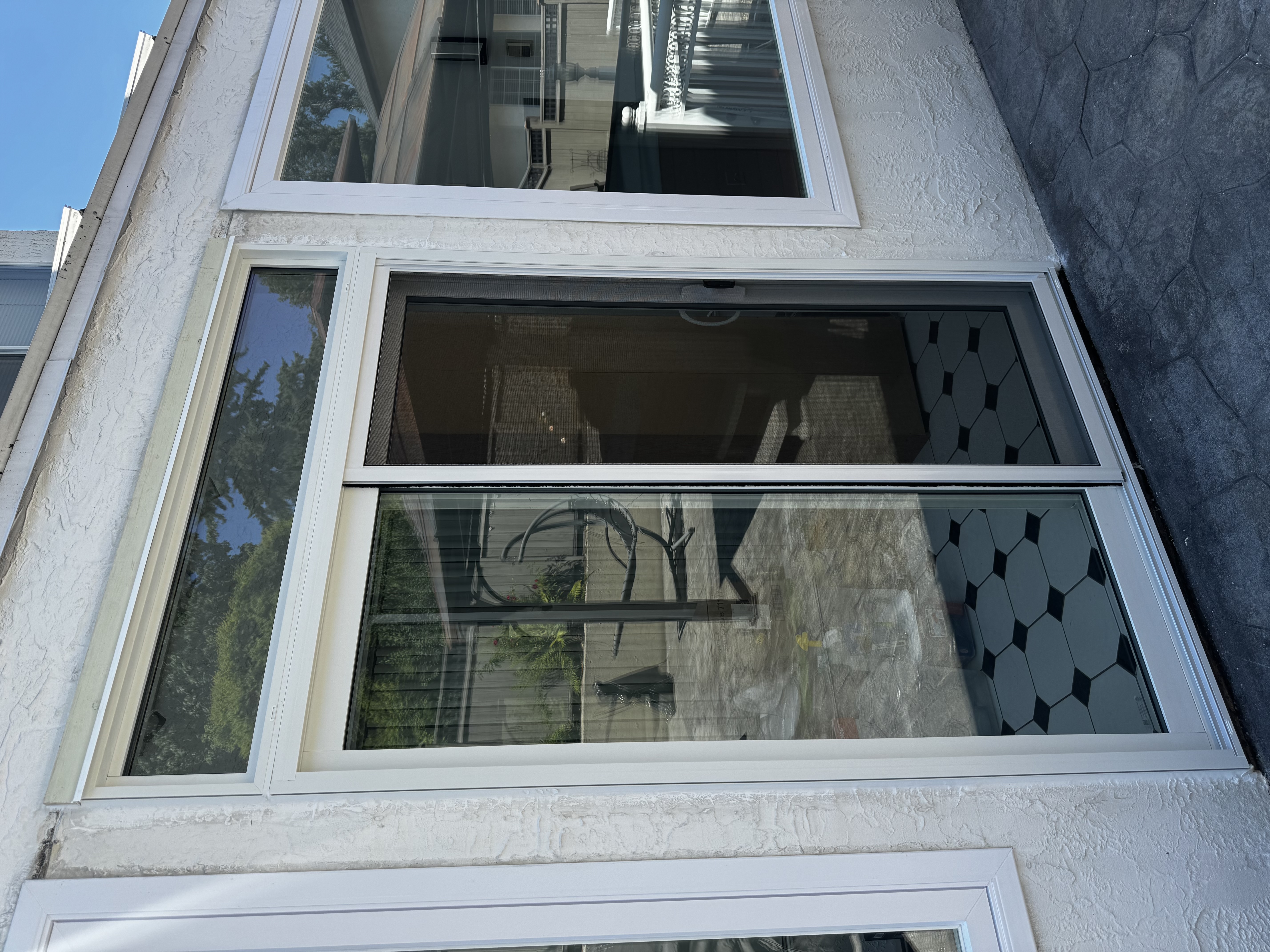 White patio door installation offering functional and stylish backyard access in Port Moody