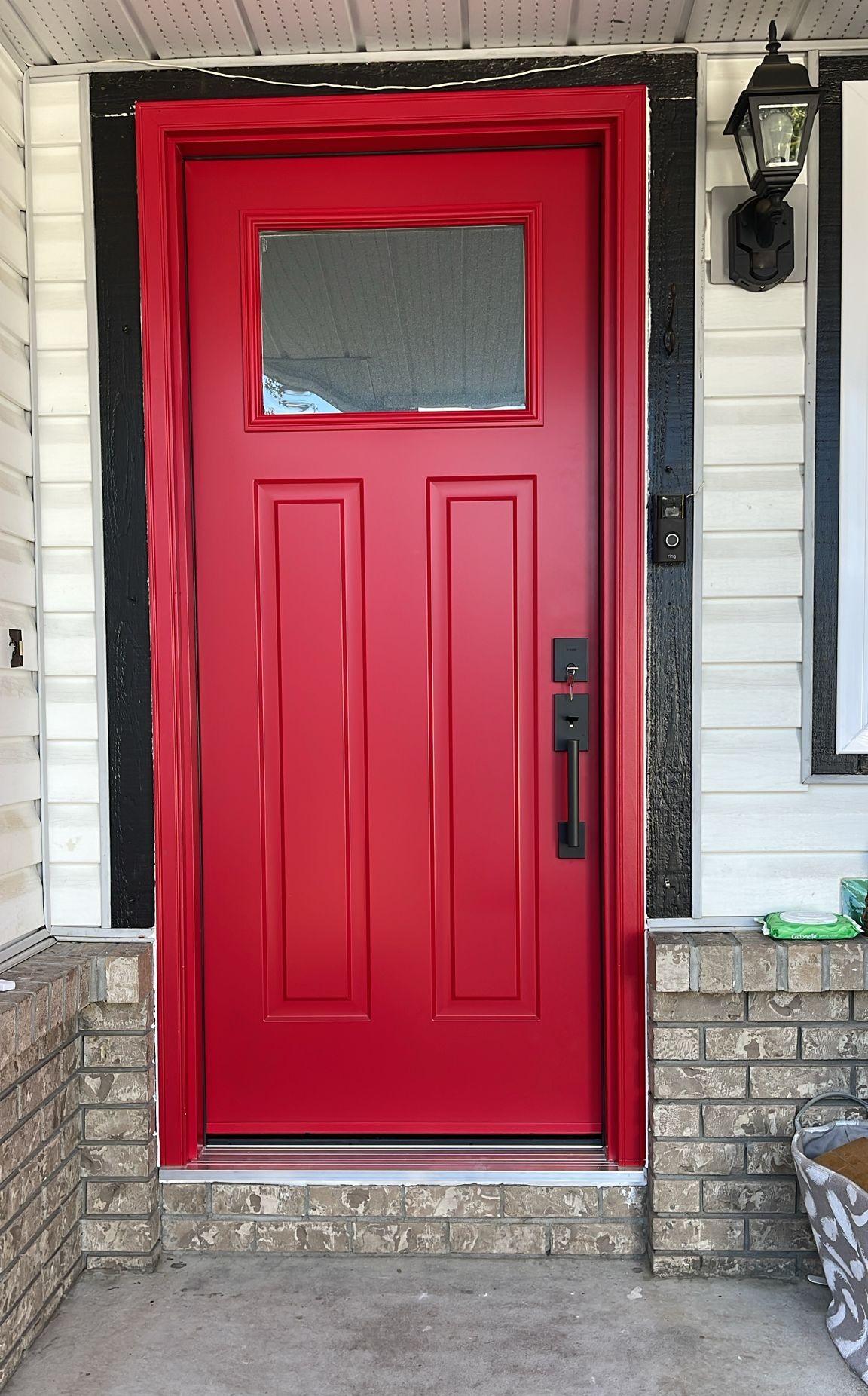 Custom red doorway enhancing modern Delta house exterior